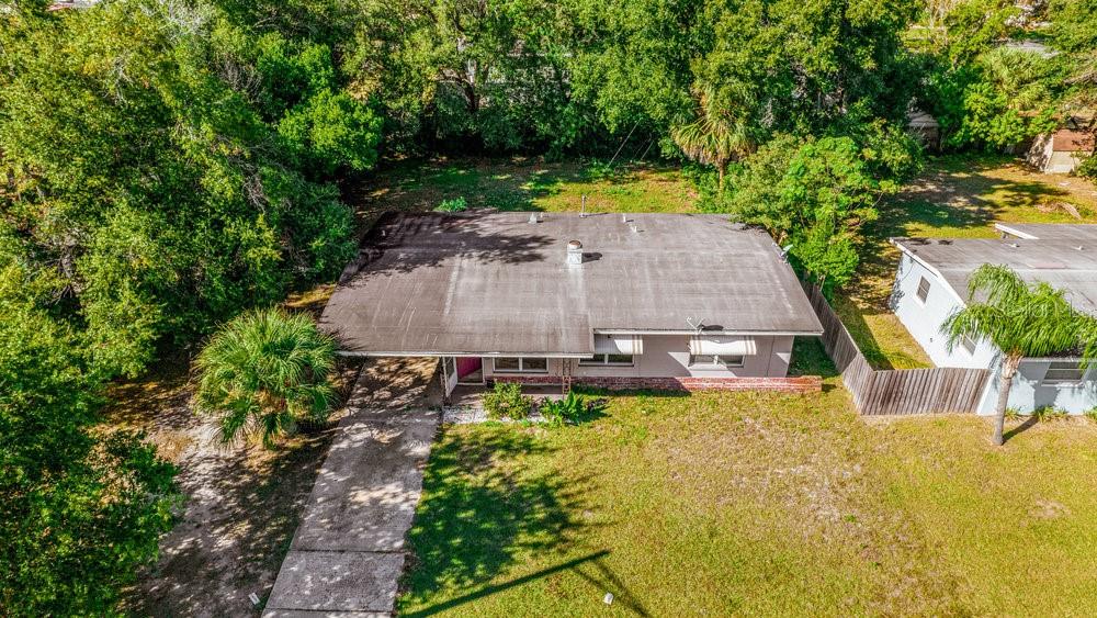 1406 South Conway Road Orlando, FL 32812 - Photo 7 of 30 a view of a swimming pool with a patio and a yard