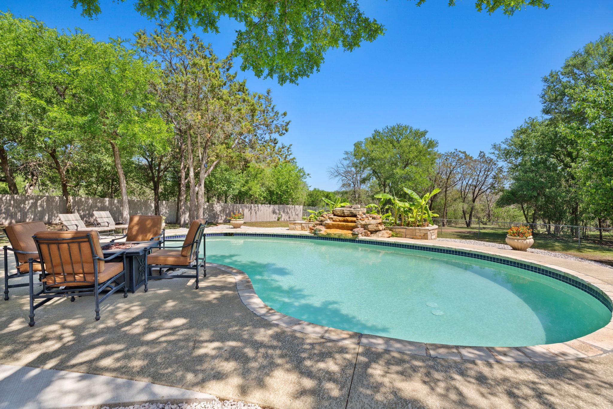 2409 Mormon Mill Road Marble Falls, TX 78654 - Photo 21 of 30 a view of a swimming pool and lounge chair