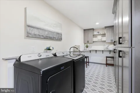 a kitchen with stainless steel appliances a sink stove and cabinets