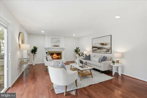 a bathroom with a granite countertop sink a toilet and a mirror