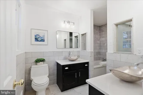 a bathroom with a bathtub and a sink