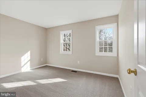 a bathroom with a sink double vanity and a toilet