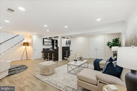 a kitchen with stainless steel appliances granite countertop a sink a stove and a microwave