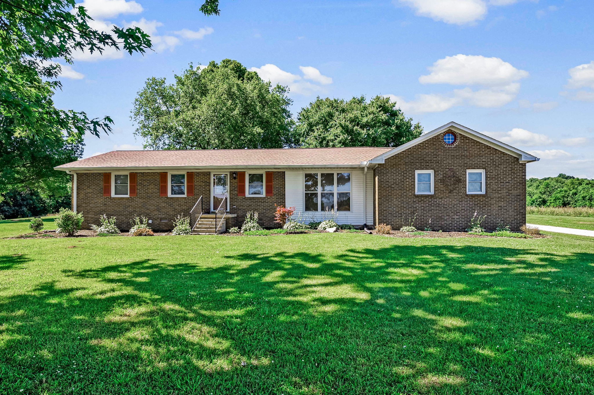 324 Jim Courtney Road Portland, TN 37148 - Photo 1 of 28 a front view of a house with a yard