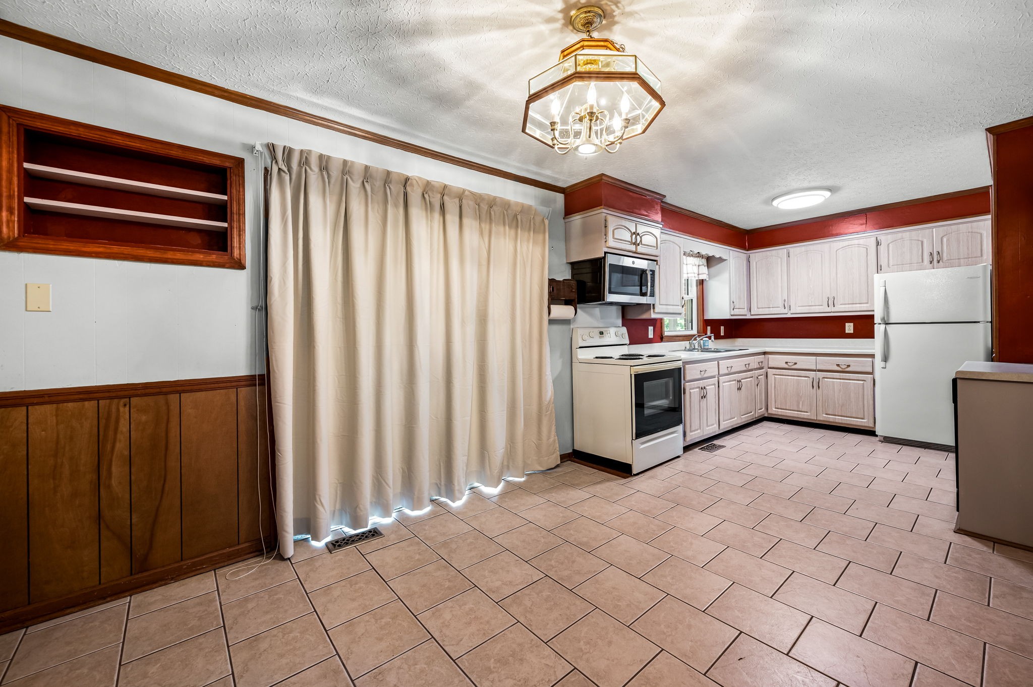 324 Jim Courtney Road Portland, TN 37148 - Photo 12 of 28 a kitchen with stainless steel appliances a stove top oven cabinets and a refrigerator