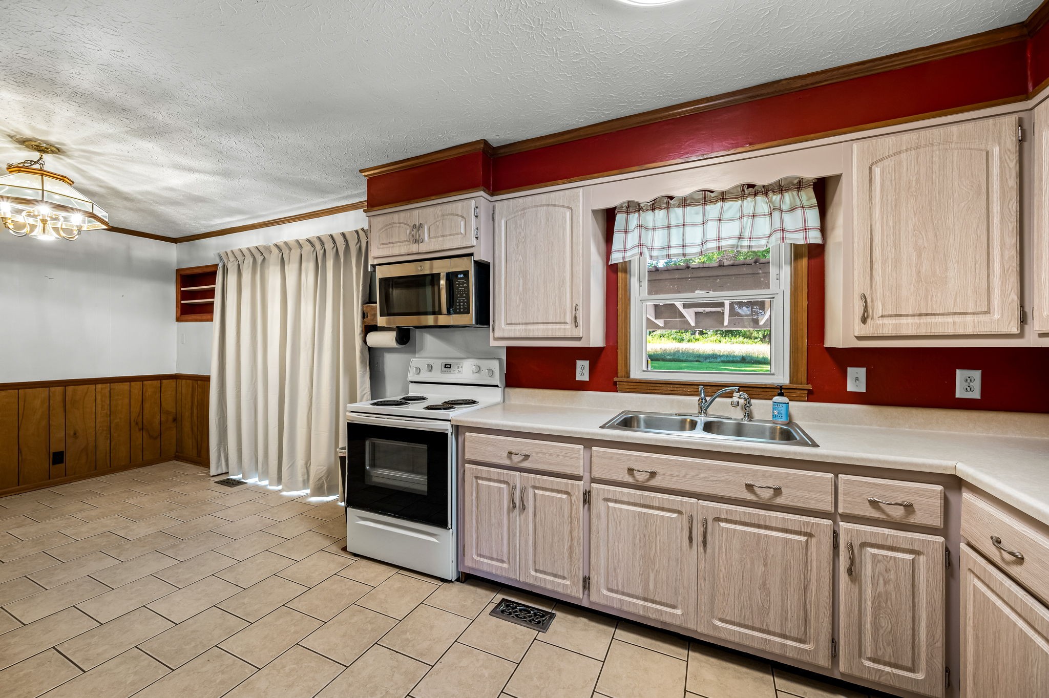 324 Jim Courtney Road Portland, TN 37148 - Photo 15 of 28 a kitchen with granite countertop a sink stainless steel appliances and cabinets