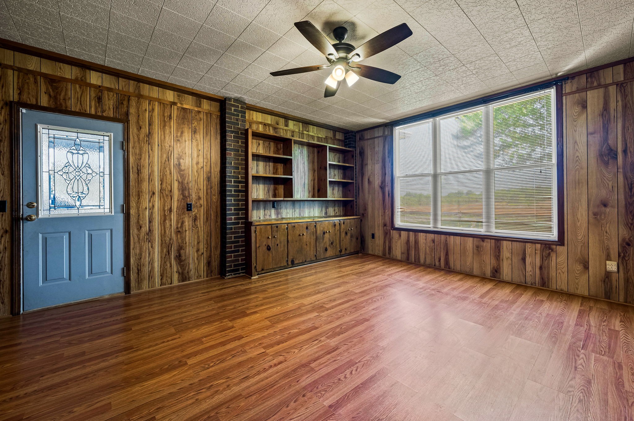 324 Jim Courtney Road Portland, TN 37148 - Photo 16 of 28 a view of an empty room with a window and wooden floor
