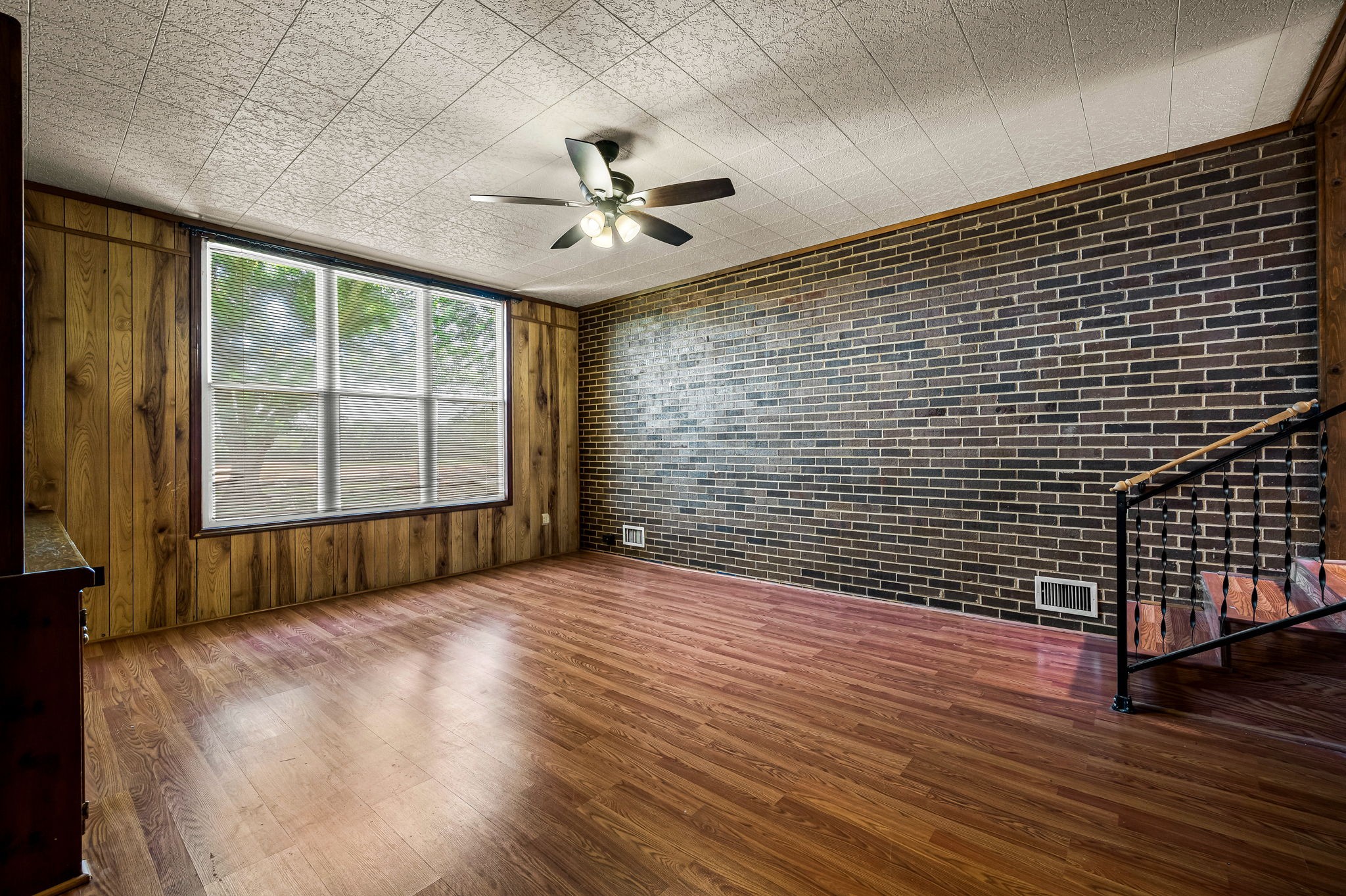 324 Jim Courtney Road Portland, TN 37148 - Photo 18 of 28 a view of an empty room with wooden floor and a window
