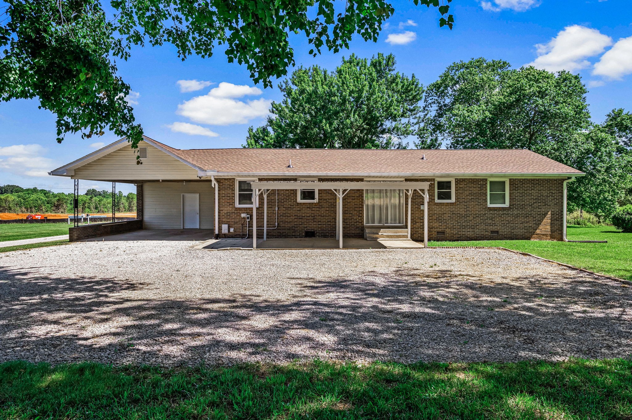 324 Jim Courtney Road Portland, TN 37148 - Photo 22 of 28 a front view of a house with a garden