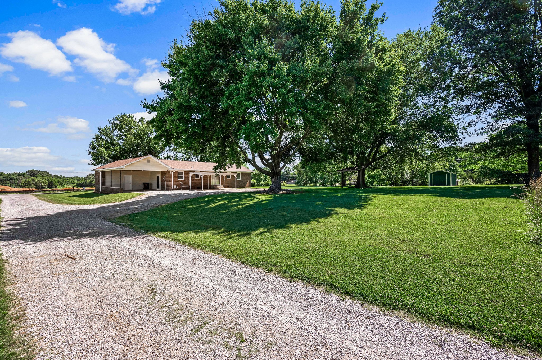 324 Jim Courtney Road Portland, TN 37148 - Photo 23 of 28 a front view of a house with garden