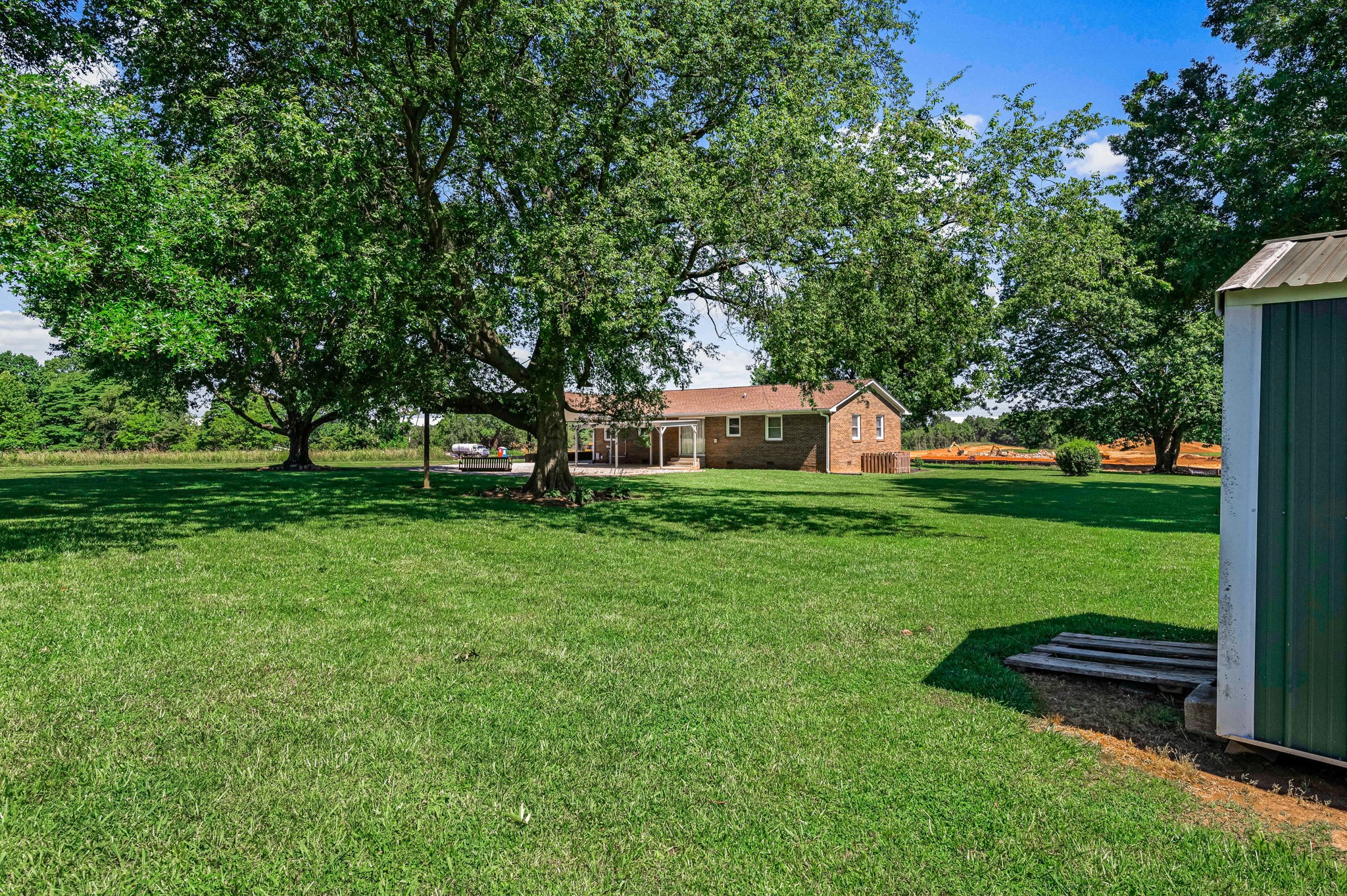 324 Jim Courtney Road Portland, TN 37148 - Photo 25 of 28 a front view of a house with garden and trees