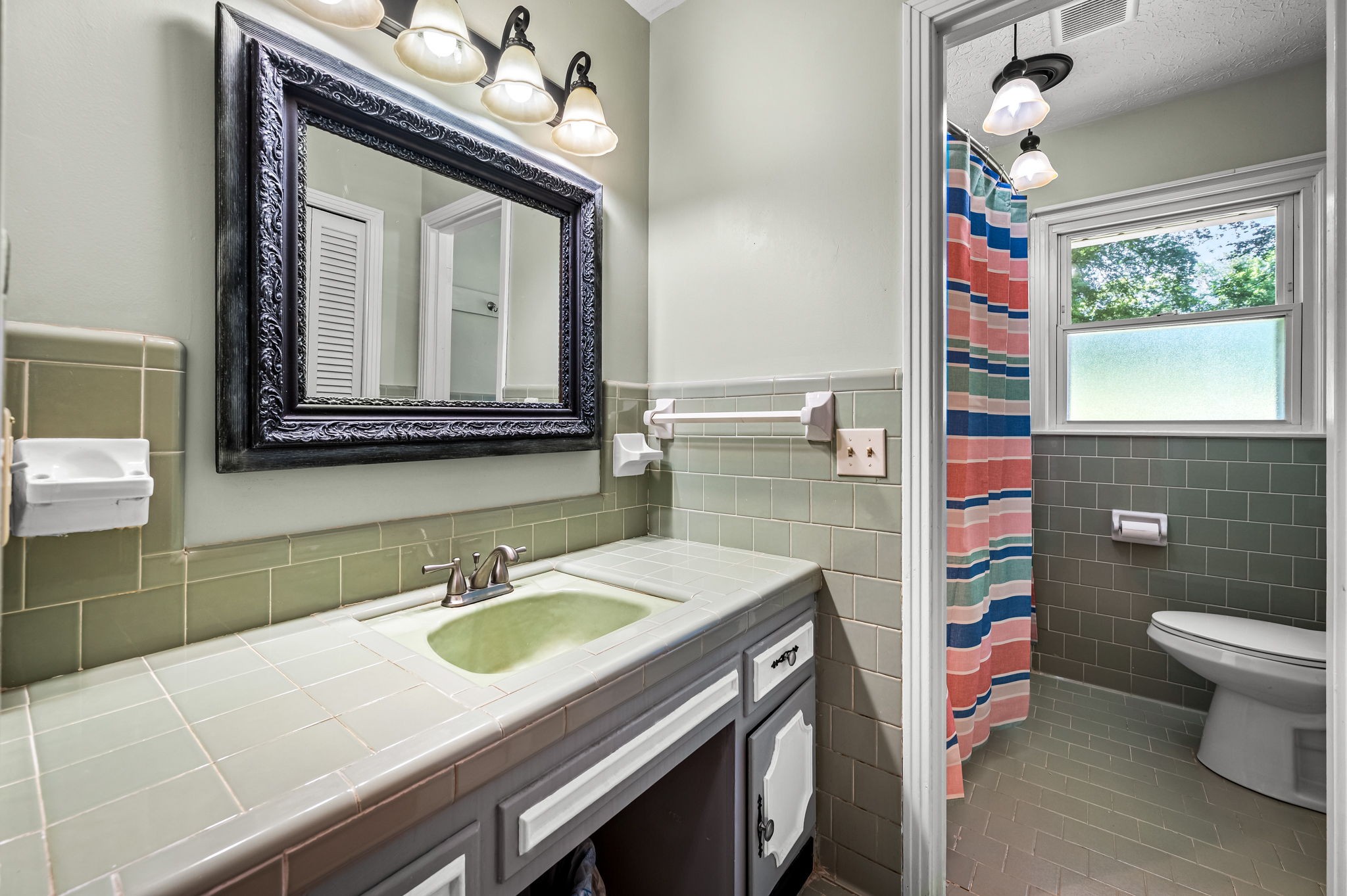 324 Jim Courtney Road Portland, TN 37148 - Photo 9 of 28 a bathroom with a sink a toilet and mirror