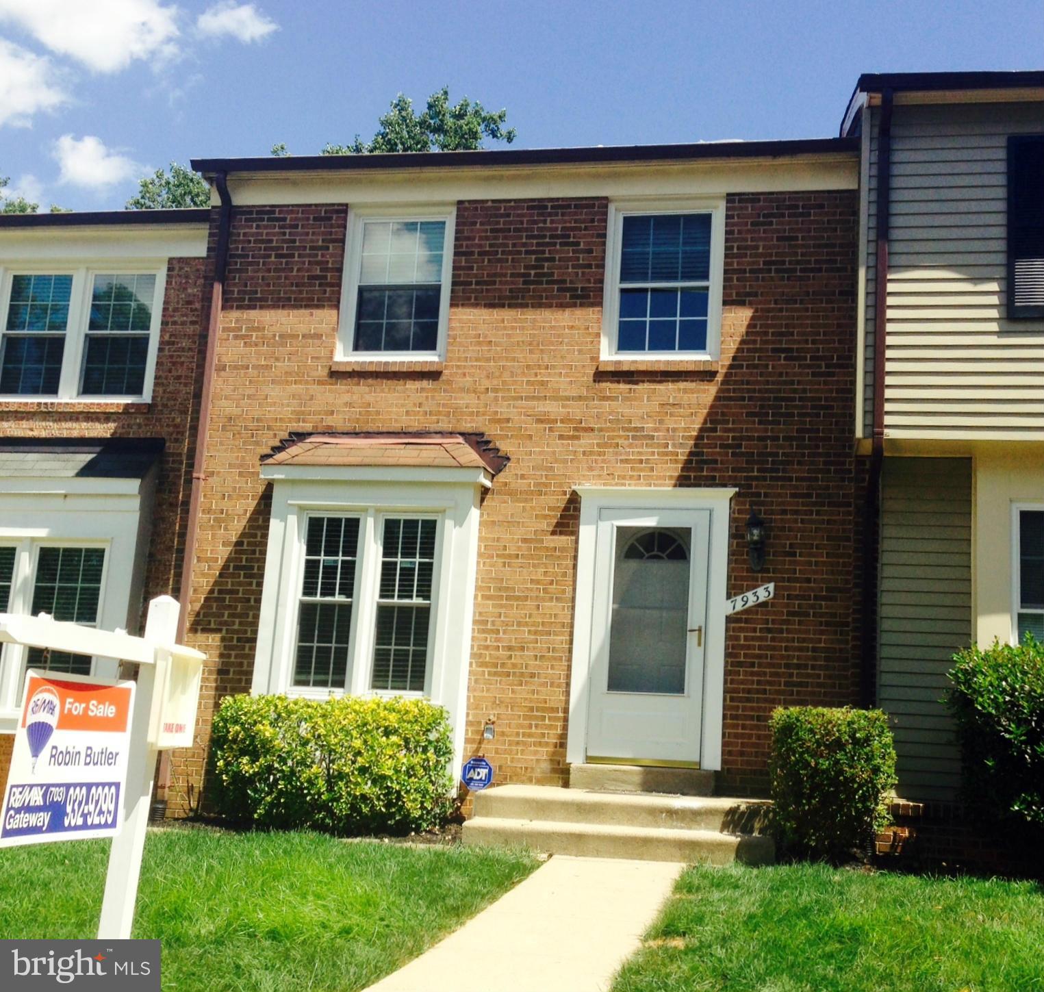 7933 Pebble Brook Court Springfield, VA 22153 - Photo 1 of 18 a front view of a house with a yard