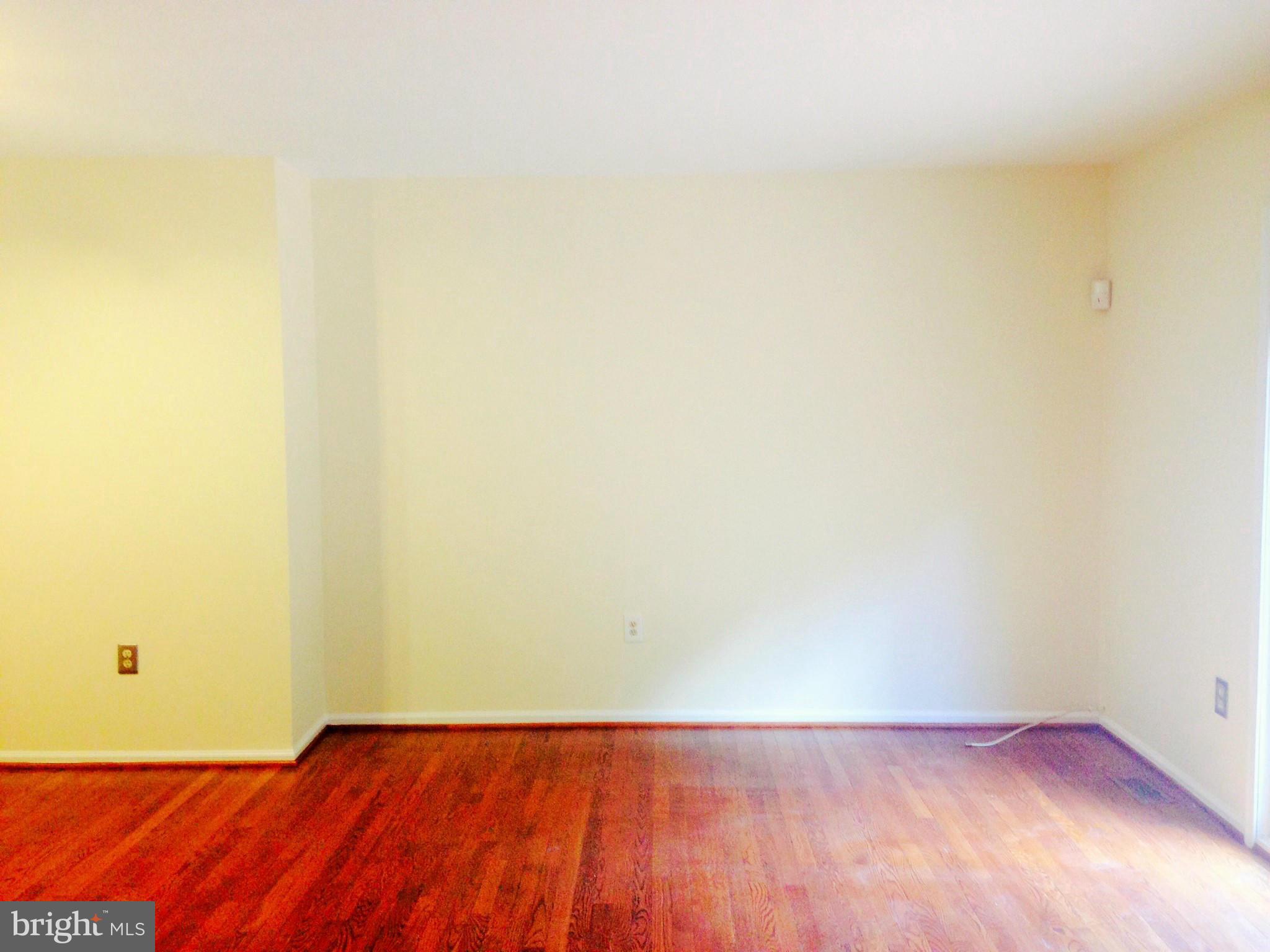 7933 Pebble Brook Court Springfield, VA 22153 - Photo 5 of 18 a view of an empty room with wooden floor
