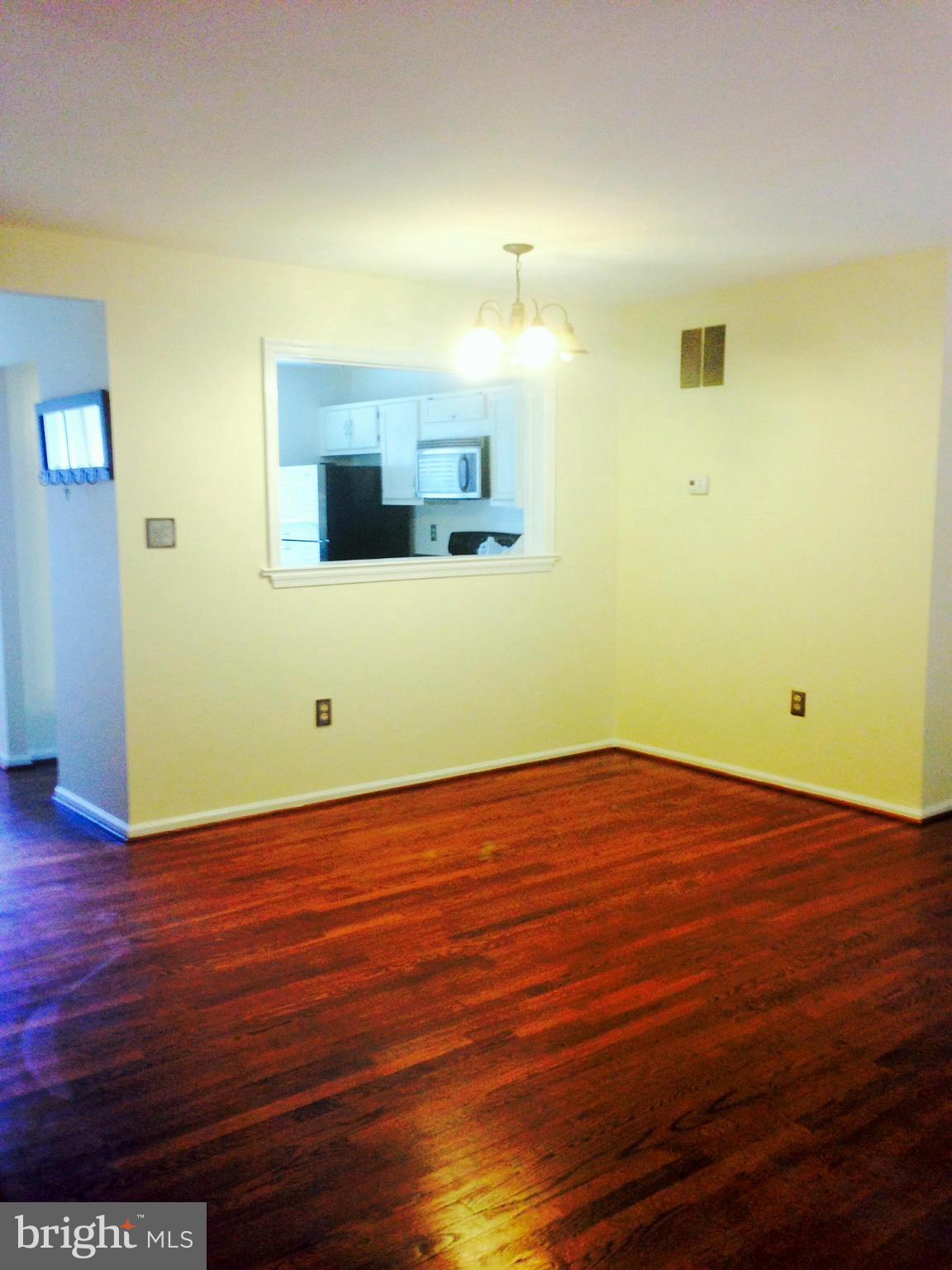 7933 Pebble Brook Court Springfield, VA 22153 - Photo 7 of 18 a view of empty room with wooden floor