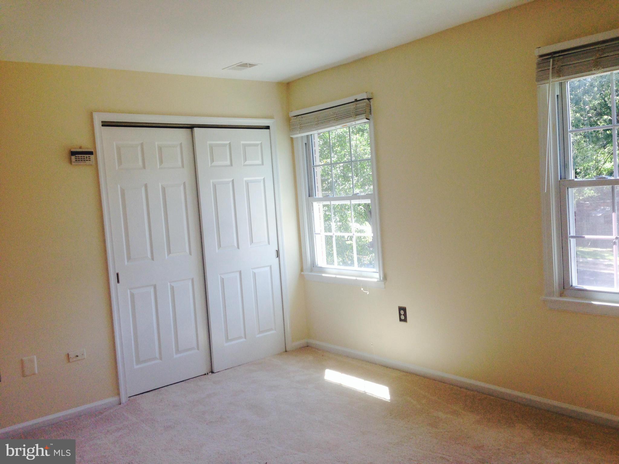 7933 Pebble Brook Court Springfield, VA 22153 - Photo 8 of 18 an empty room with windows