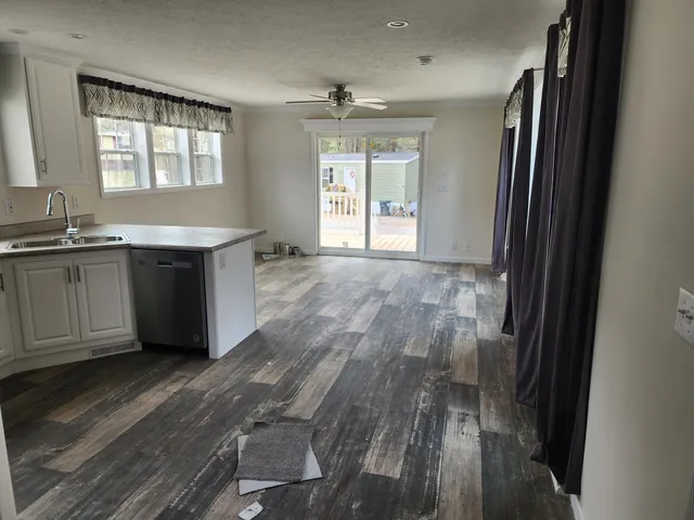 a room with wooden floor and window
