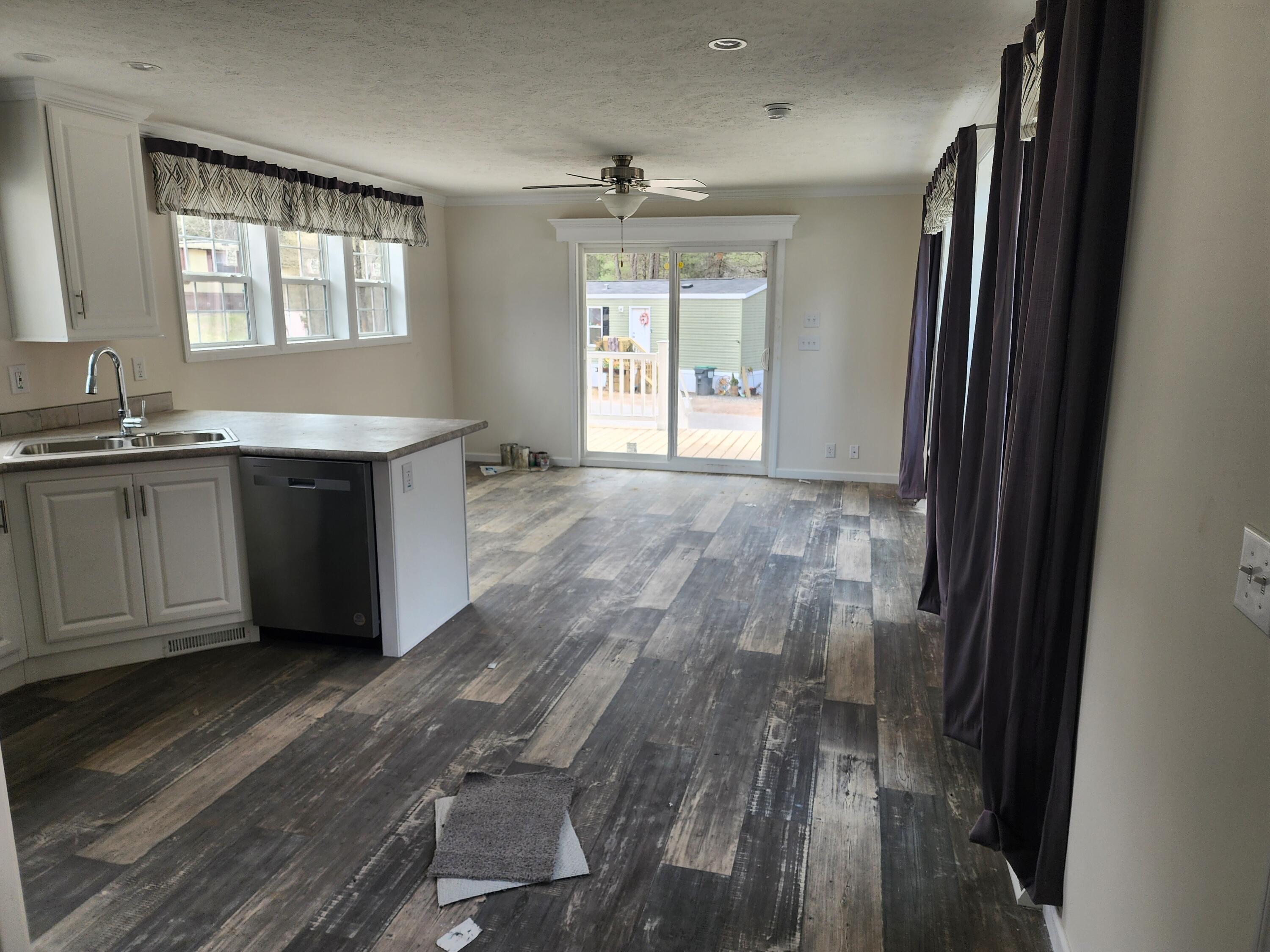 1117 Lonesome Lock Road White Mills, PA 18428 - Photo 4 of 10 a room with wooden floor and window