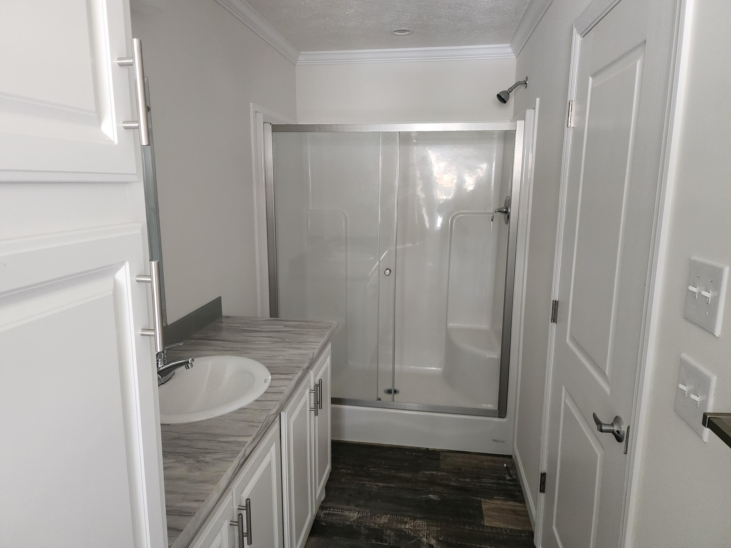 1117 Lonesome Lock Road White Mills, PA 18428 - Photo 6 of 10 a bathroom with a granite countertop sink mirror vanity and toilet