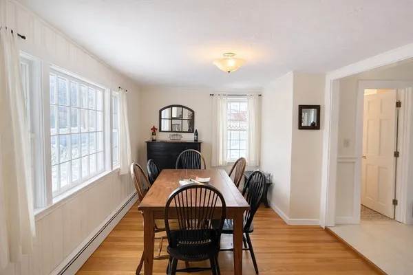 a dining room with furniture and window