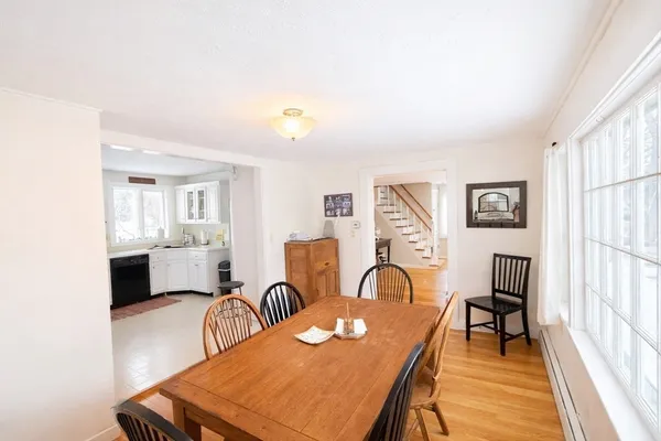 a view of a dining room with furniture and a window