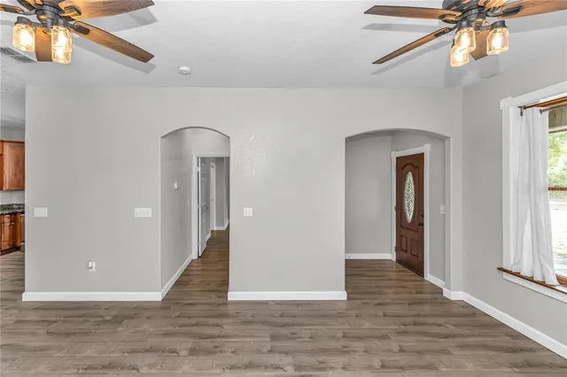 a kitchen with stainless steel appliances granite countertop a refrigerator stove top oven and sink