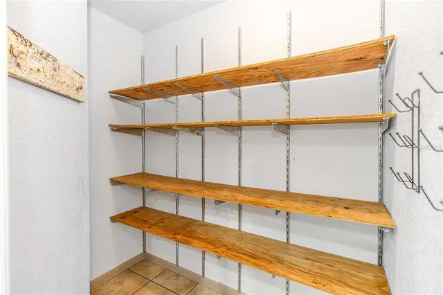 a kitchen with refrigerator and window