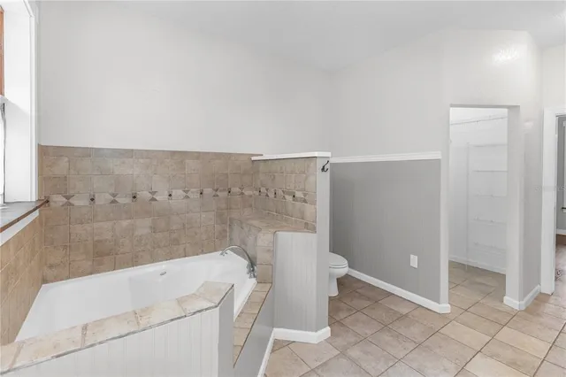 a bathroom with a shower and a toilet