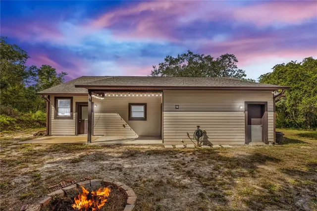 a view of outdoor space with trees all around