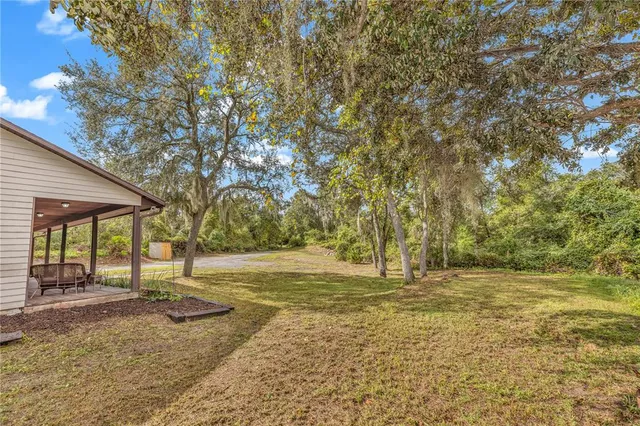 an aerial view of houses with yard