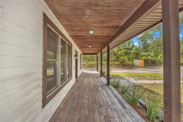 a view of a kitchen with stainless steel appliances granite countertop a refrigerator and a sink