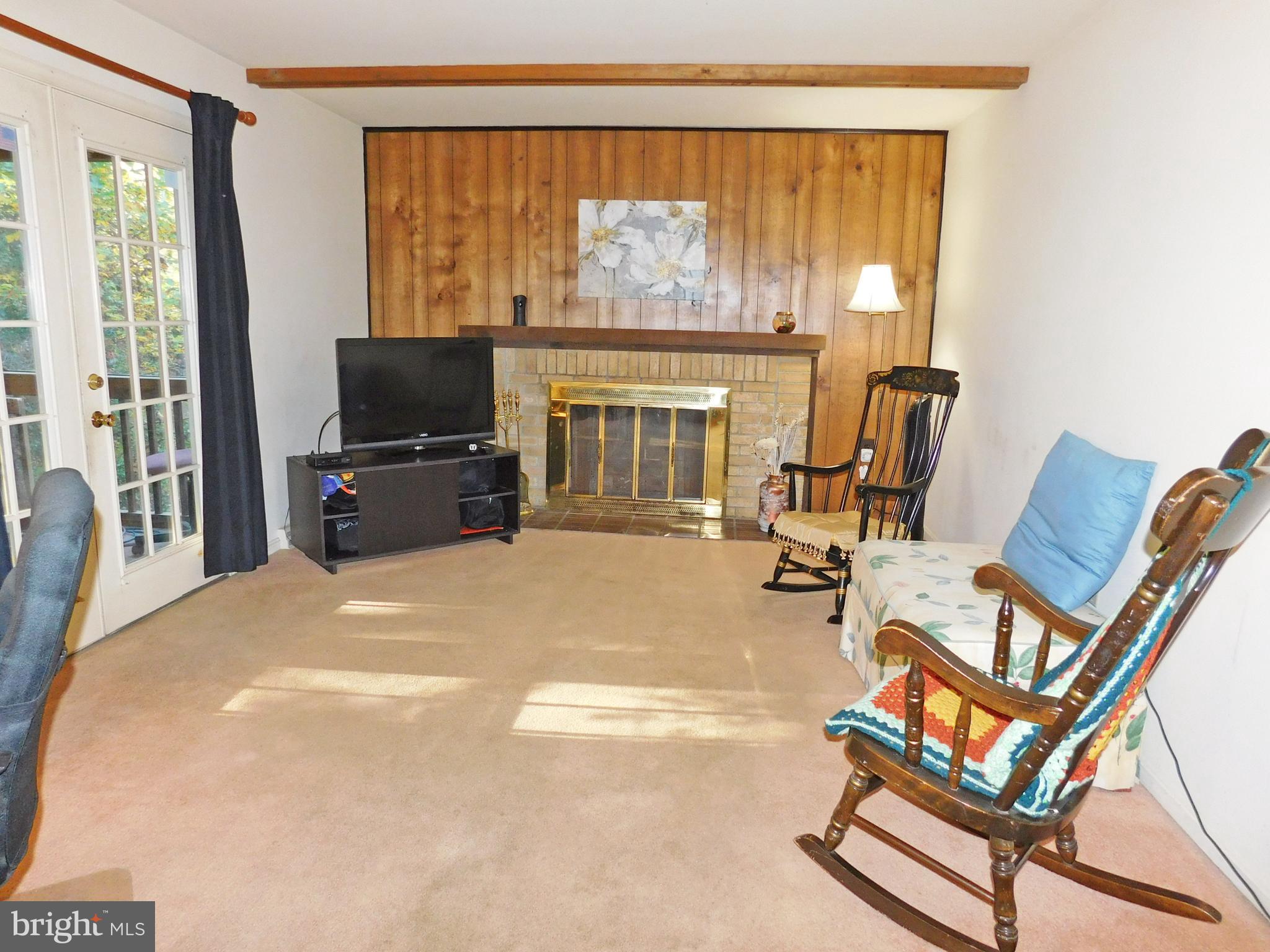 8925 Renshaw Court Springfield, VA 22153 - Photo 8 of 28 Family Rm - wood burning fplc, leads to scr porch