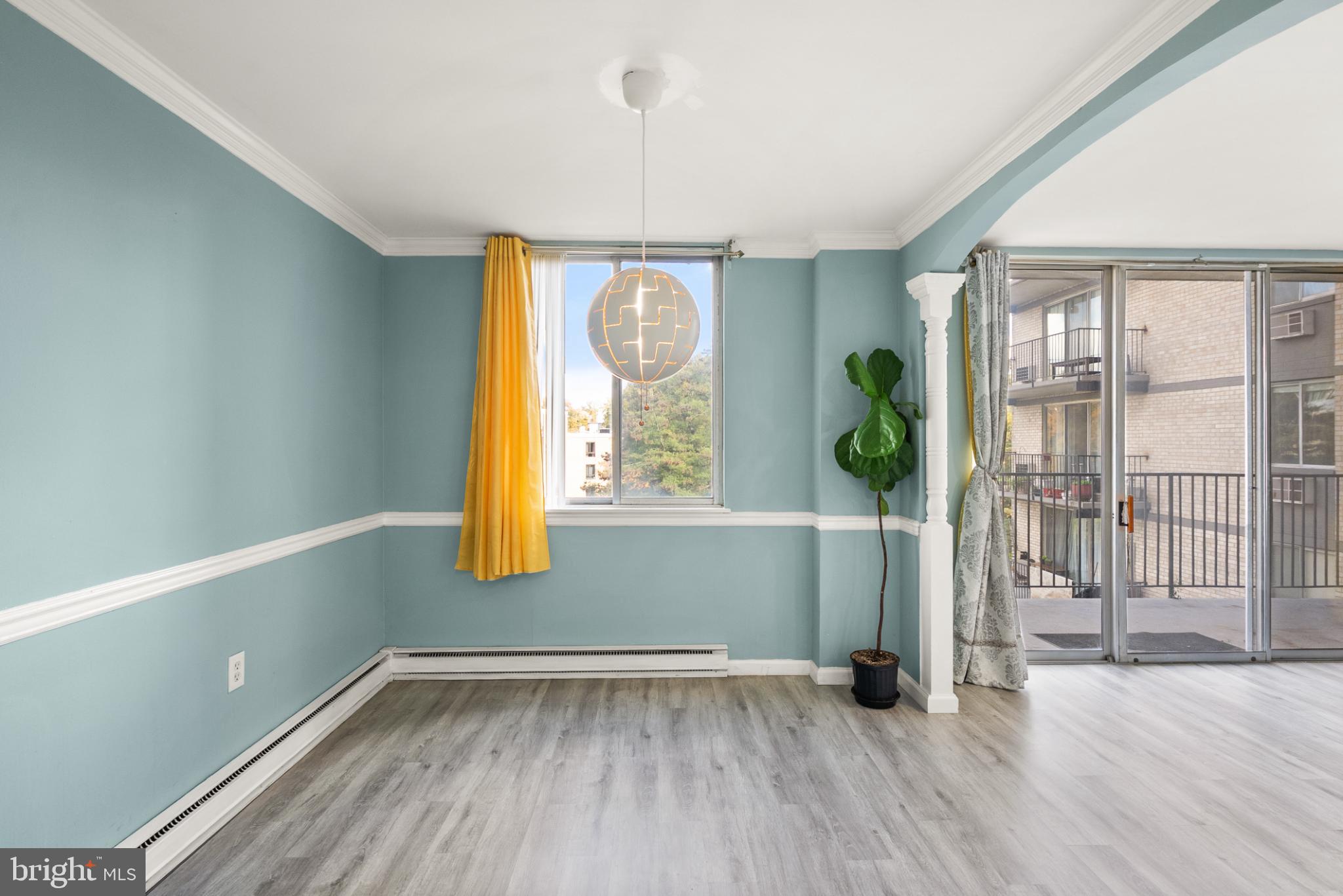 3245 Rio Drive, Unit 608 Falls Church, VA 22041 - Photo 20 of 40 a view of an empty room with wooden floor and a window