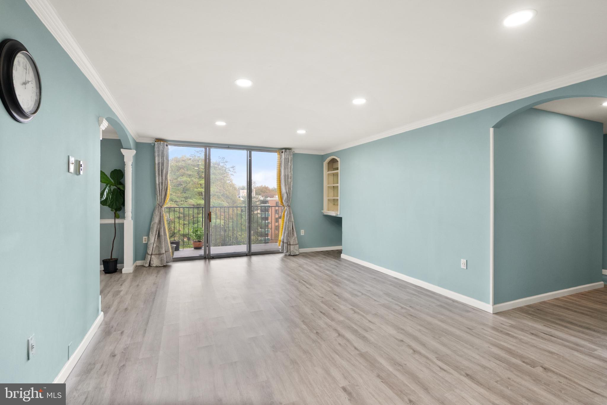 3245 Rio Drive, Unit 608 Falls Church, VA 22041 - Photo 25 of 40 an empty room with wooden floor and windows