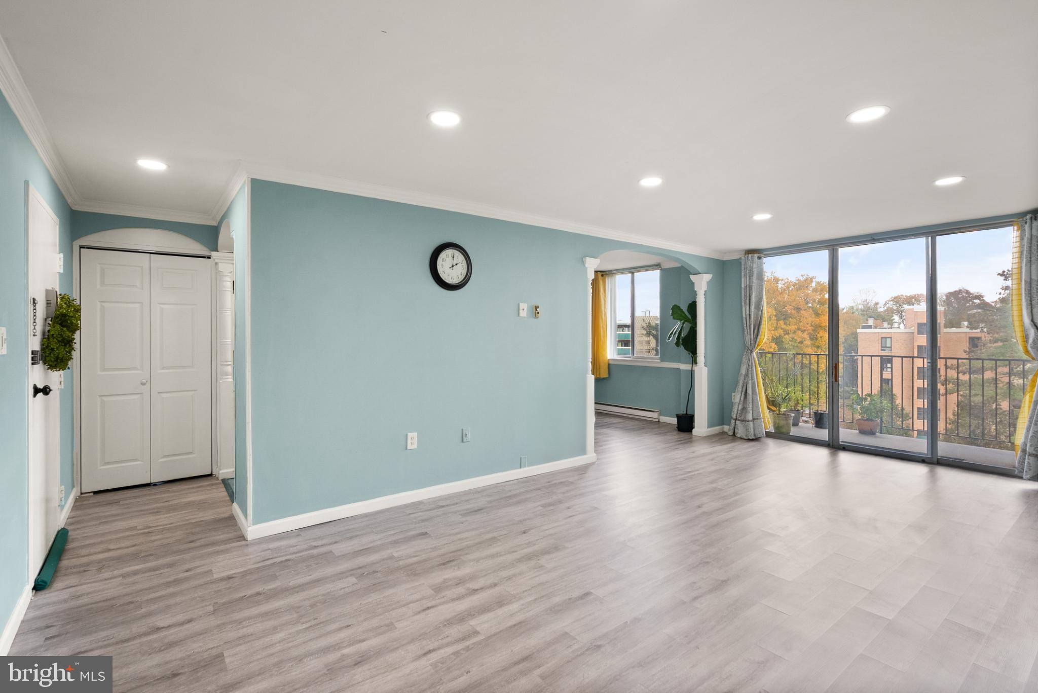 3245 Rio Drive, Unit 608 Falls Church, VA 22041 - Photo 26 of 40 a view of an empty room with wooden floor and a window