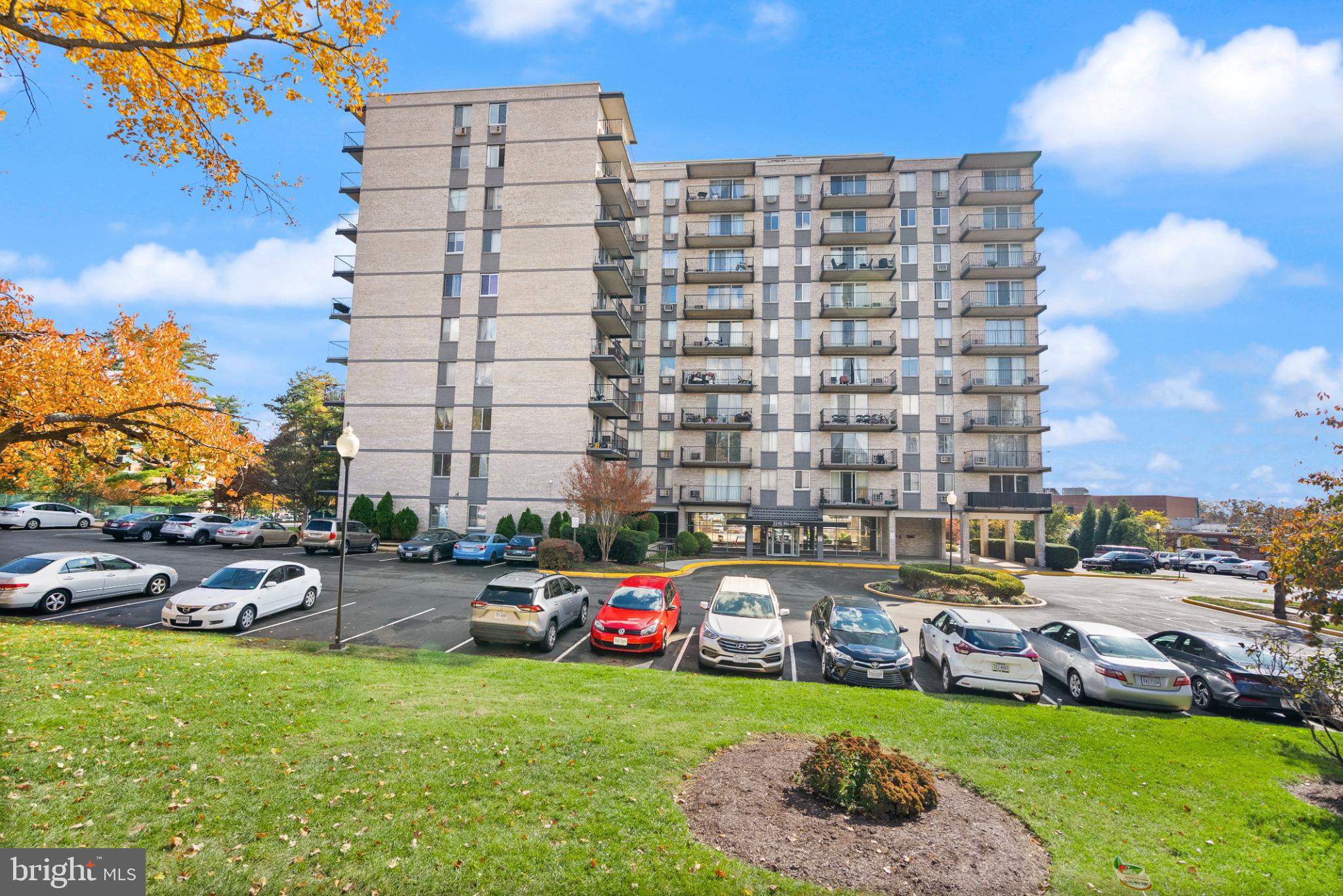 3245 Rio Drive, Unit 608 Falls Church, VA 22041 - Photo 7 of 40 a city view with tall buildings and a yard