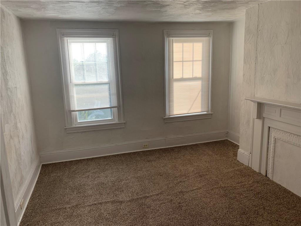 725 Clarissa Street Pittsburgh, PA 15219 - Photo 9 of 14 an empty room with a window