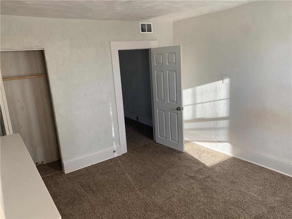 725 Clarissa Street Pittsburgh, PA 15219 - Photo 10 of 14 a view of empty room with front door