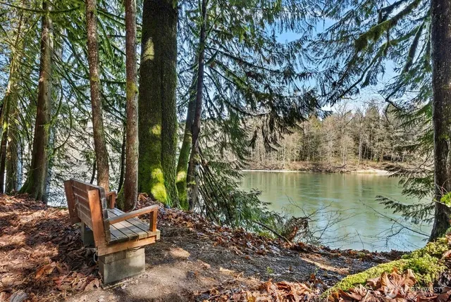 a view of a lake with outdoor seating
