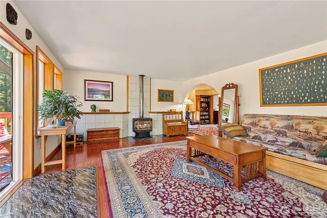 a living room with furniture rug and window