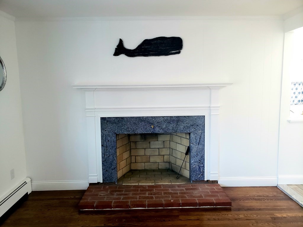 18 Harvard Road Dennis, MA 02639 - Photo 11 of 32 a living room with a fireplace