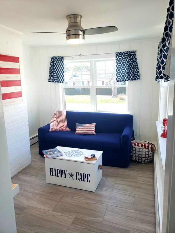 18 Harvard Road Dennis, MA 02639 - Photo 12 of 32 a living room with furniture and a window