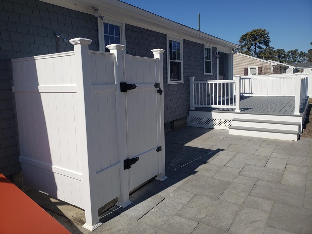 18 Harvard Road Dennis, MA 02639 - Photo 3 of 32 a view of a house with a white door