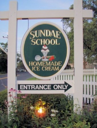 18 Harvard Road Dennis, MA 02639 - Photo 32 of 32 a sign that is on a brick wall