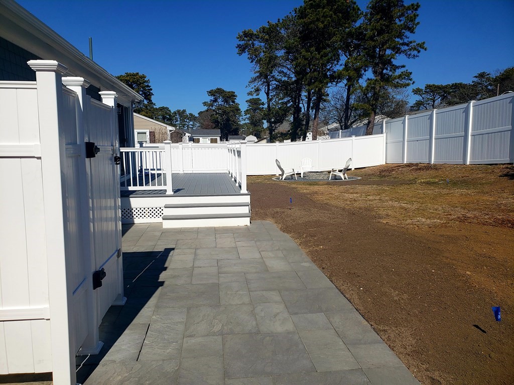 18 Harvard Road Dennis, MA 02639 - Photo 5 of 32 a view of a house with a yard
