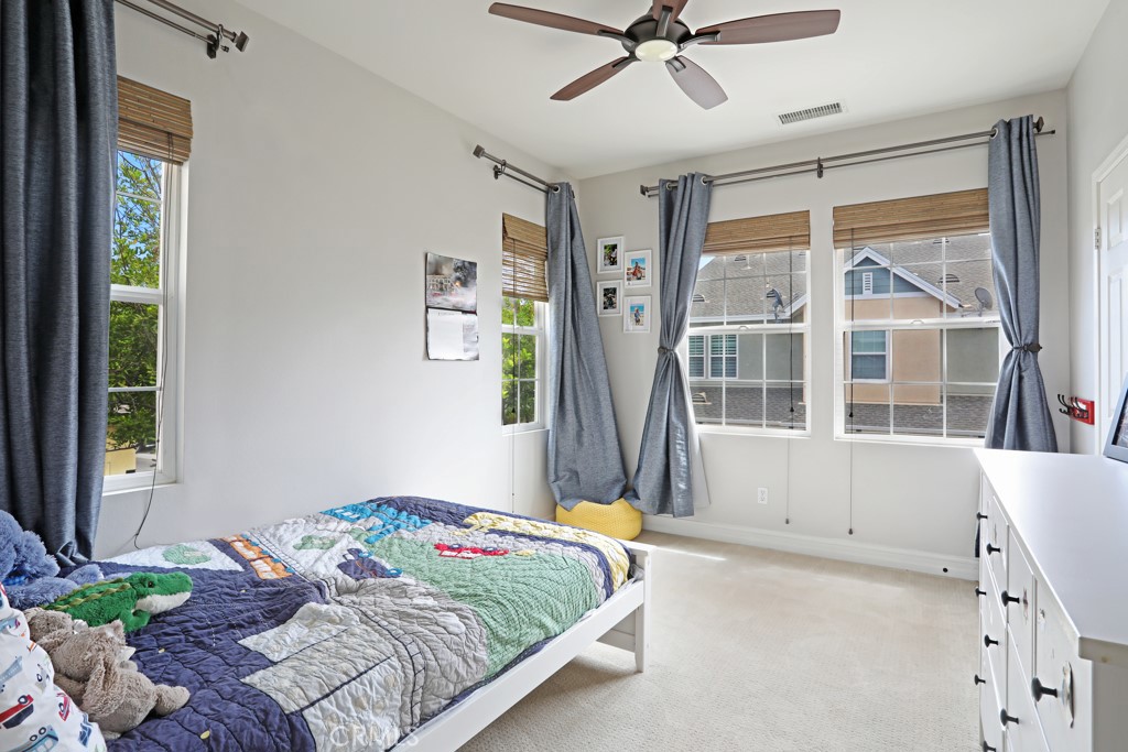 9 Orange Blossom Circle Ladera Ranch, CA 92694 - Photo 12 of 24 a bedroom with a bed and a window
