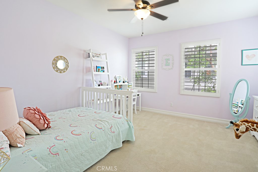 9 Orange Blossom Circle Ladera Ranch, CA 92694 - Photo 13 of 24 a bedroom with a bed dresser and a window