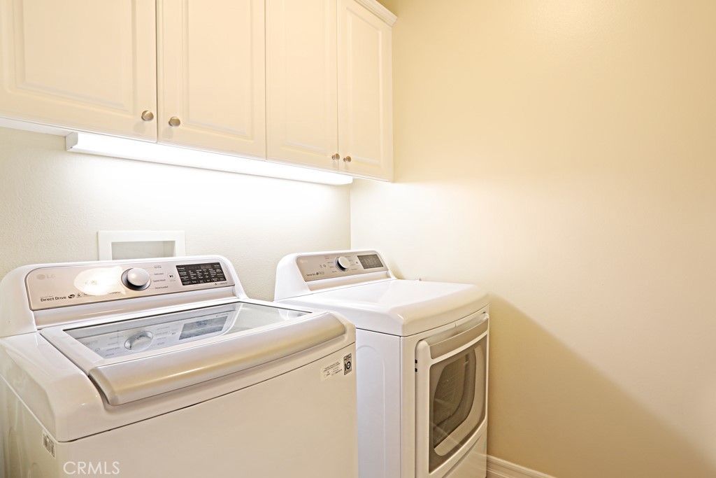 9 Orange Blossom Circle Ladera Ranch, CA 92694 - Photo 14 of 24 a utility room with dryer and washer