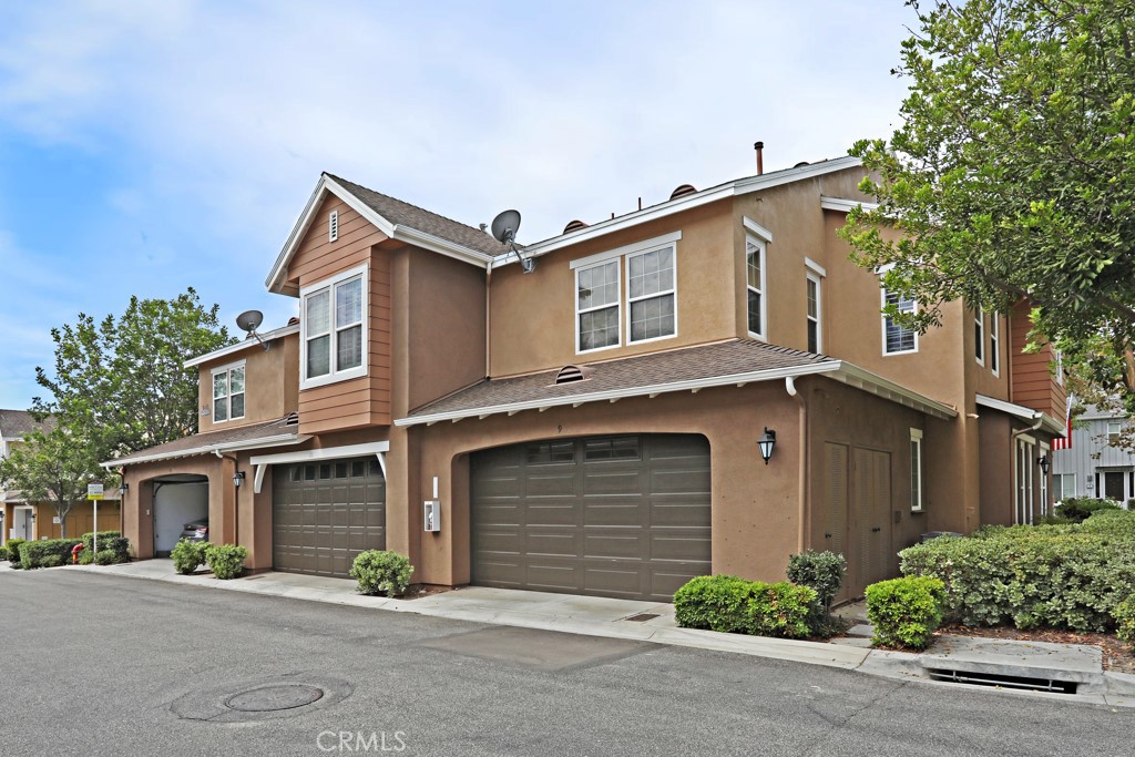 9 Orange Blossom Circle Ladera Ranch, CA 92694 - Photo 20 of 24 a front view of a house with a yard and garage
