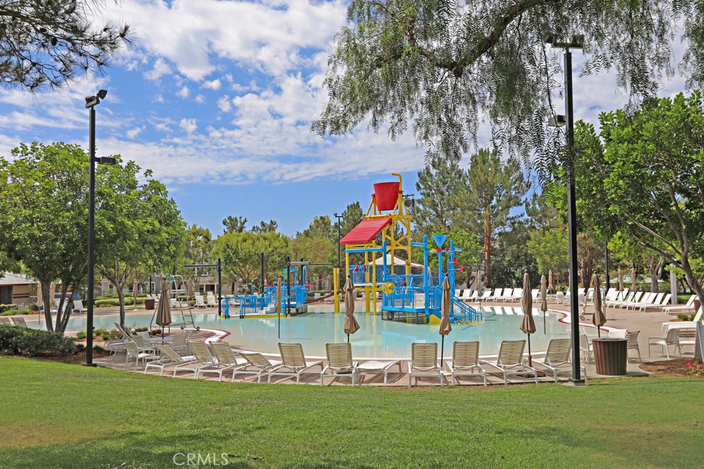 9 Orange Blossom Circle Ladera Ranch, CA 92694 - Photo 21 of 24 a front view of a multi story building with yard
